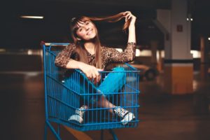 girl in a shopping cart